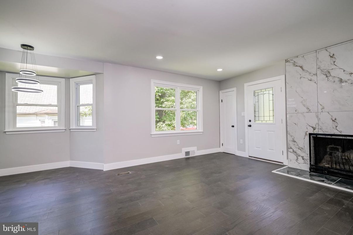 Empty room, Fireplace, Interior, Marble Walls, Pendant Lights, Recessed Lighting, Wood Texture Flooring