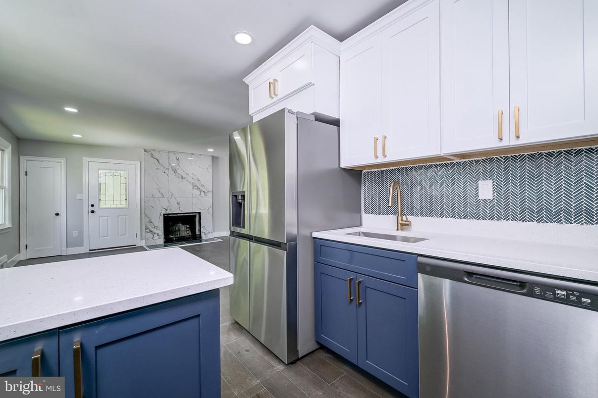 Fireplace, Interior, Kitchen, Recessed Lighting, Stainless Steel Appliances, Wood Texture Flooring