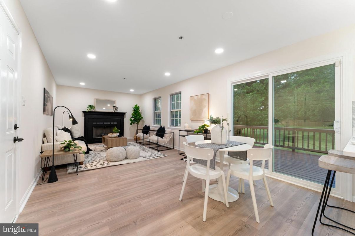 Dining room, Fireplace, Interior, Living room, Recessed Lighting, Wood Texture Flooring