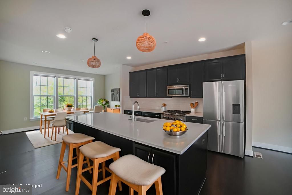 Dining room, Interior, Kitchen, Pendant Lights, Recessed Lighting, Stainless Steel Appliances, Wood Texture Flooring