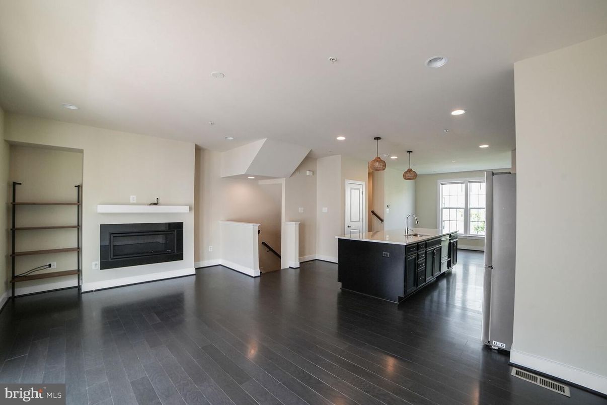 Empty room, Fireplace, Interior, Kitchen, Pendant Lights, Recessed Lighting, Wood Texture Flooring