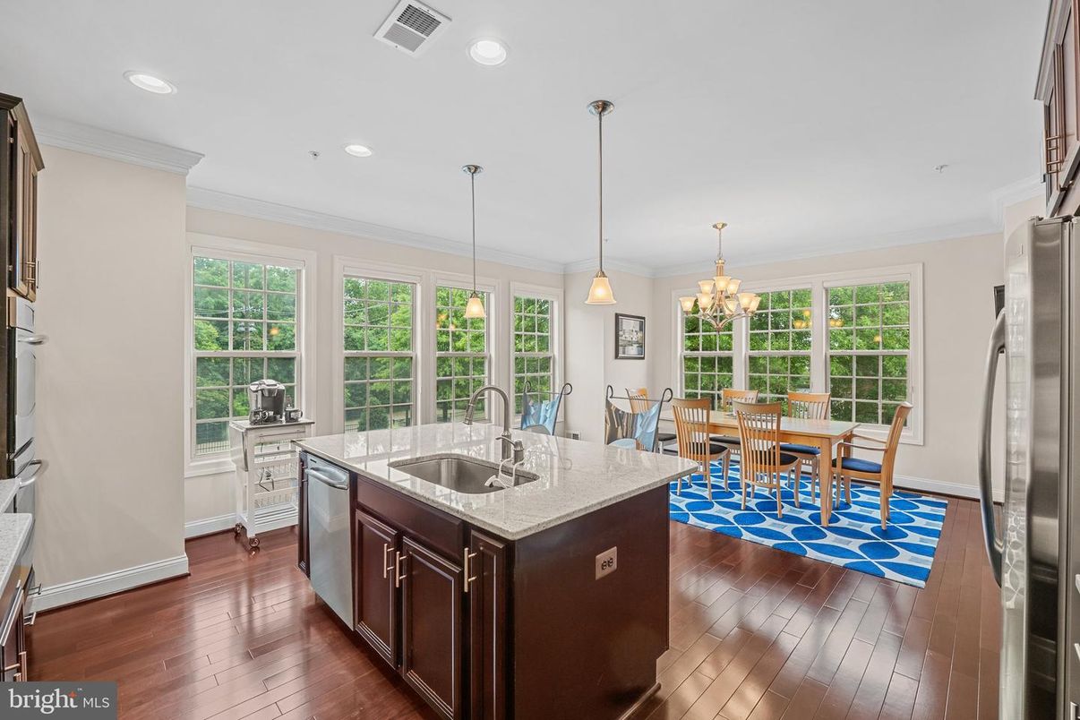 Chandelier, Dining room, Interior, Kitchen, Pendant Lights, Recessed Lighting, Stainless Steel Appliances, Wood Texture Flooring