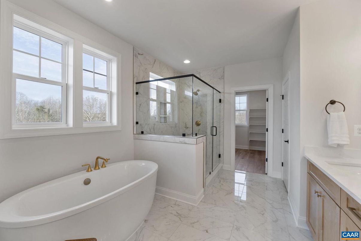 Bathroom, Free Standing Baths, Glass Shower, Interior, Marble, Marble Walls, Recessed Lighting