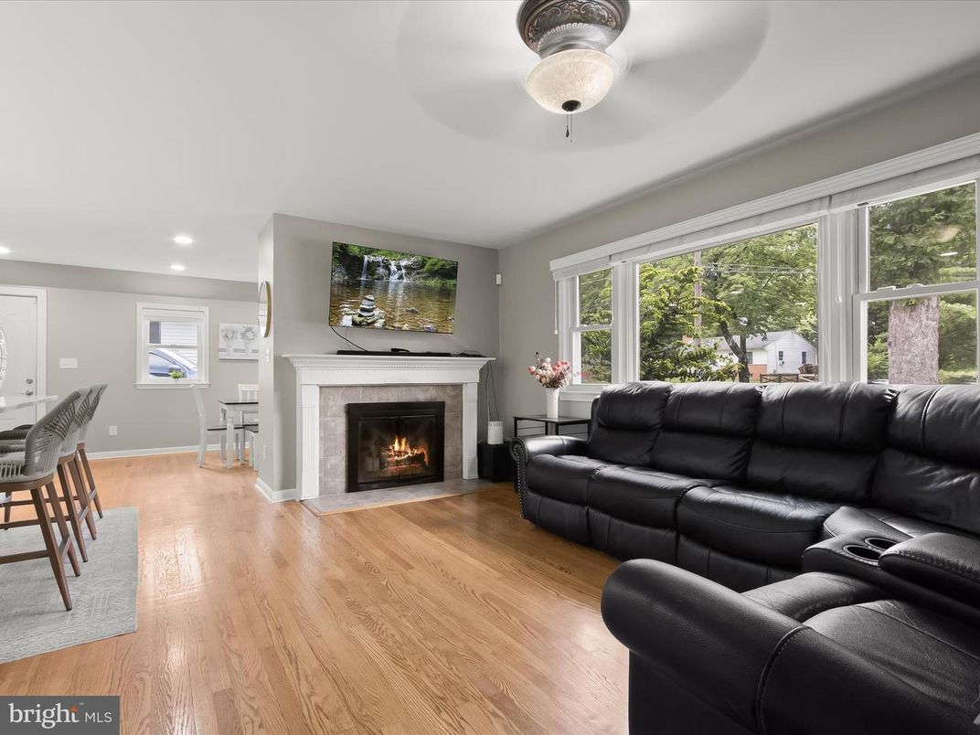 Dining room, Fireplace, Interior, Living room, Recessed Lighting, Wood Texture Flooring