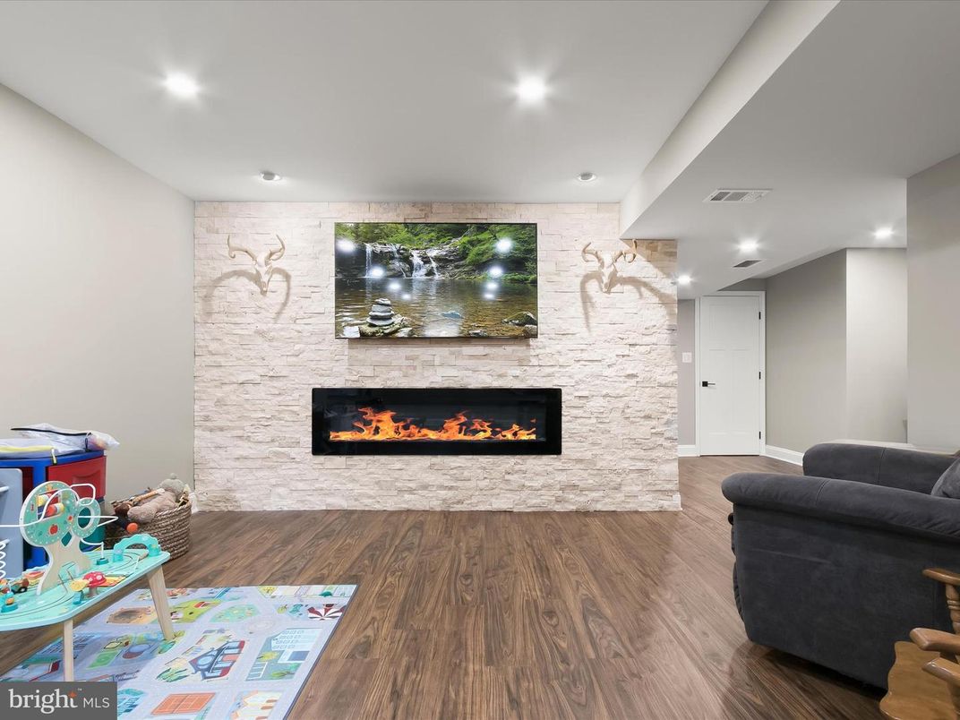 Fireplace, Interior, Recessed Lighting, Stone Walls, Wood Texture Flooring