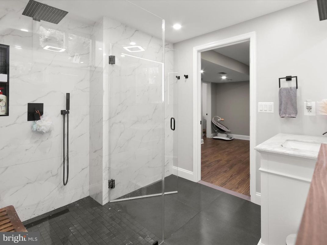 Bathroom, Glass Shower, Interior, Marble Walls, Recessed Lighting, Wood Texture Flooring