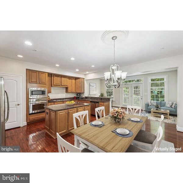 Chandelier, Dining room, Interior, Kitchen, Living room, Recessed Lighting, Stainless Steel Appliances, Wood Texture Flooring