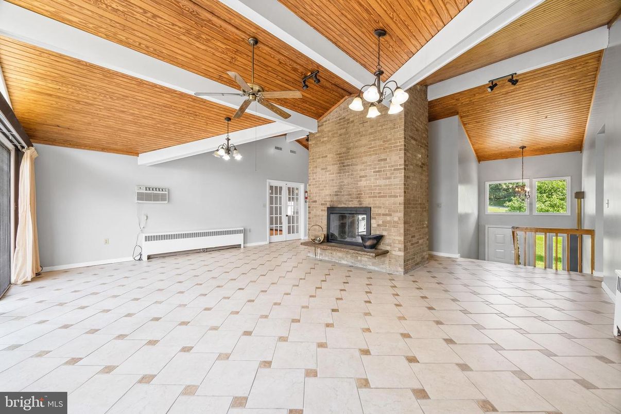 Empty room, Fireplace, Interior, Pendant Lights, Stone Walls, Wooden Ceilings