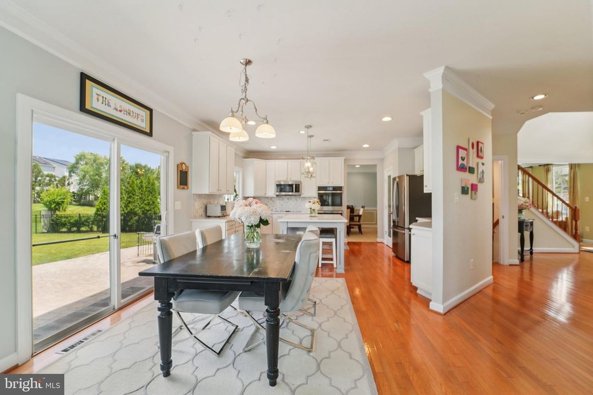 Dining room, Interior, Kitchen, Pendant Lights, Recessed Lighting, Stainless Steel Appliances, Wood Texture Flooring