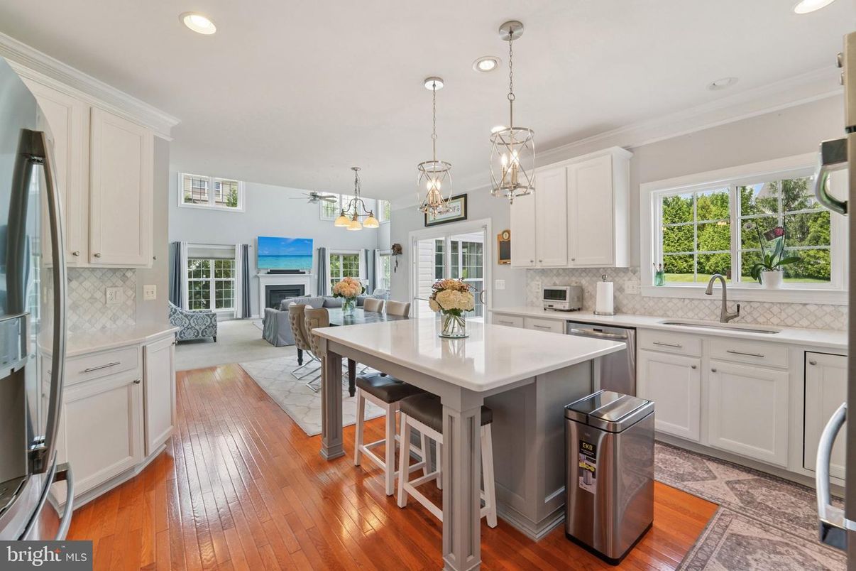Dining room, Fireplace, Interior, Kitchen, Living room, Pendant Lights, Recessed Lighting, Stainless Steel Appliances, Wood Texture Flooring