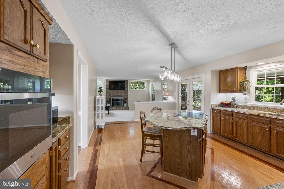 Dining room, Fireplace, Interior, Kitchen, Pendant Lights, Wood Texture Flooring