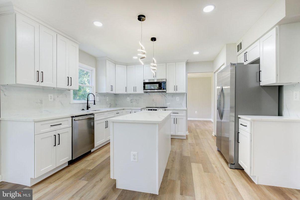 Interior, Kitchen, Marble Walls, Pendant Lights, Recessed Lighting, Stainless Steel Appliances, Wood Texture Flooring