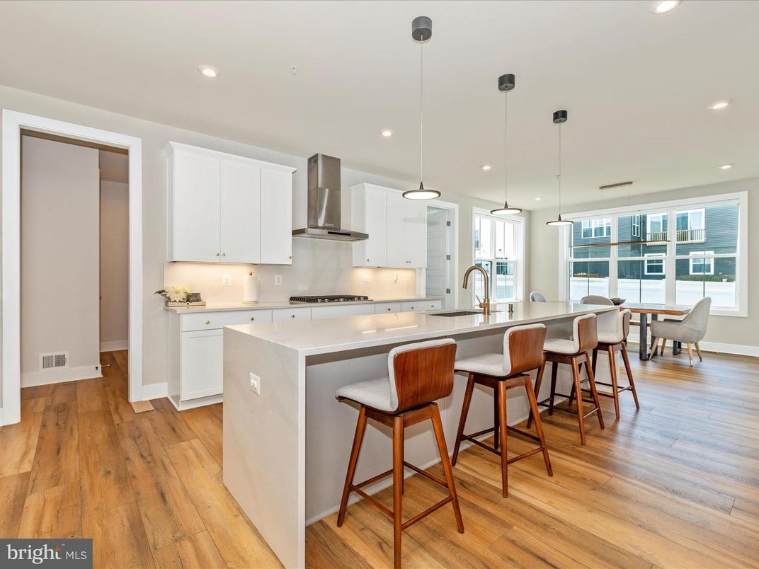 Dining room, Interior, Kitchen, Pendant Lights, Recessed Lighting, Stainless Steel Appliances, Wood Texture Flooring