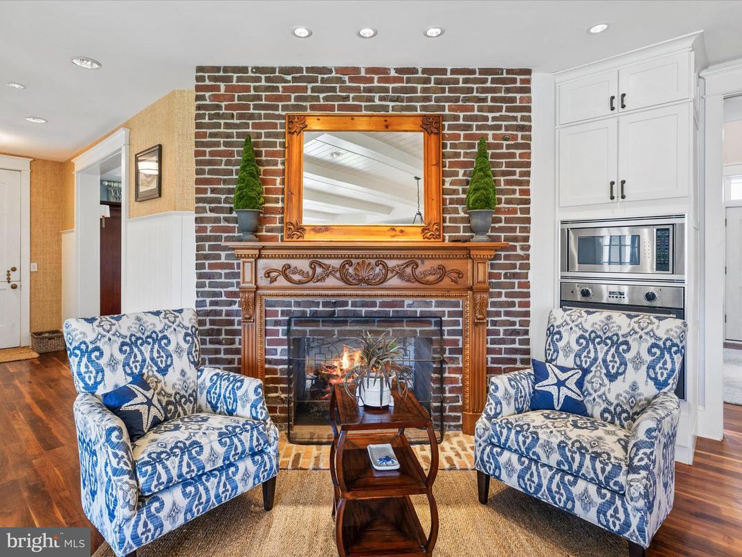 Fireplace, Interior, Living room, Recessed Lighting, Stone Walls, Wood Texture Flooring