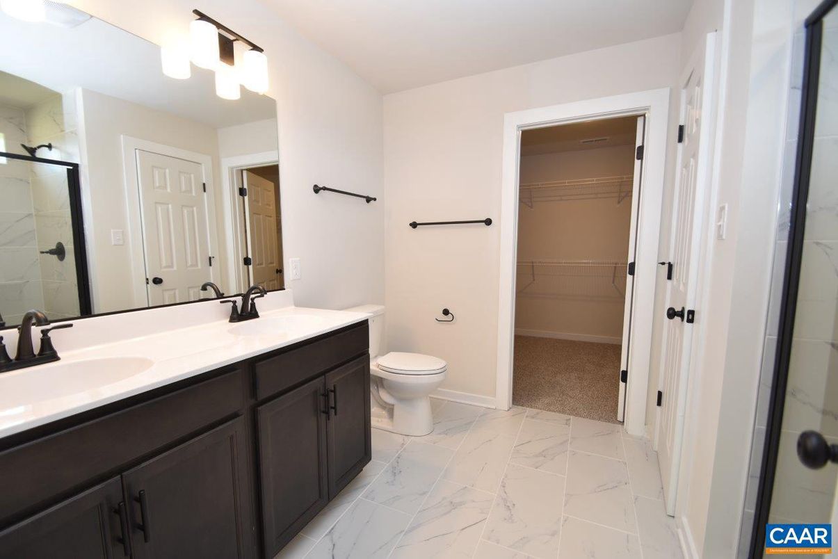 Bathroom, Dual Sink Vanities, Interior, Marble, Marble Walls, Walk-in Closets