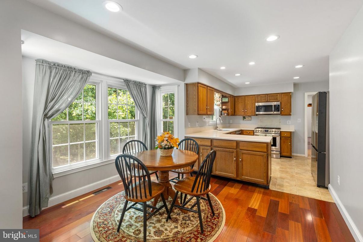 Dining room, Interior, Kitchen, Recessed Lighting, Stainless Steel Appliances, Wood Texture Flooring