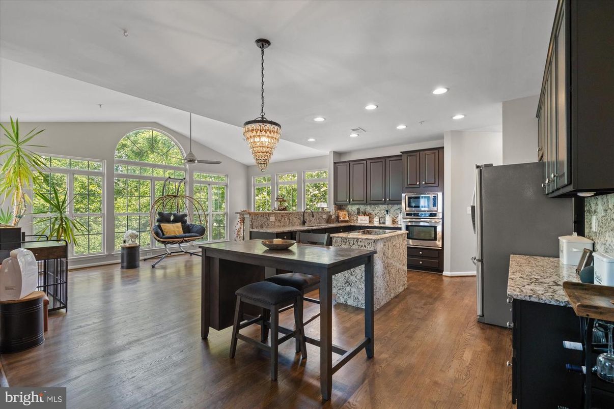 Chandelier, Dining room, Interior, Kitchen, Pendant Lights, Recessed Lighting, Stainless Steel Appliances, Wood Texture Flooring