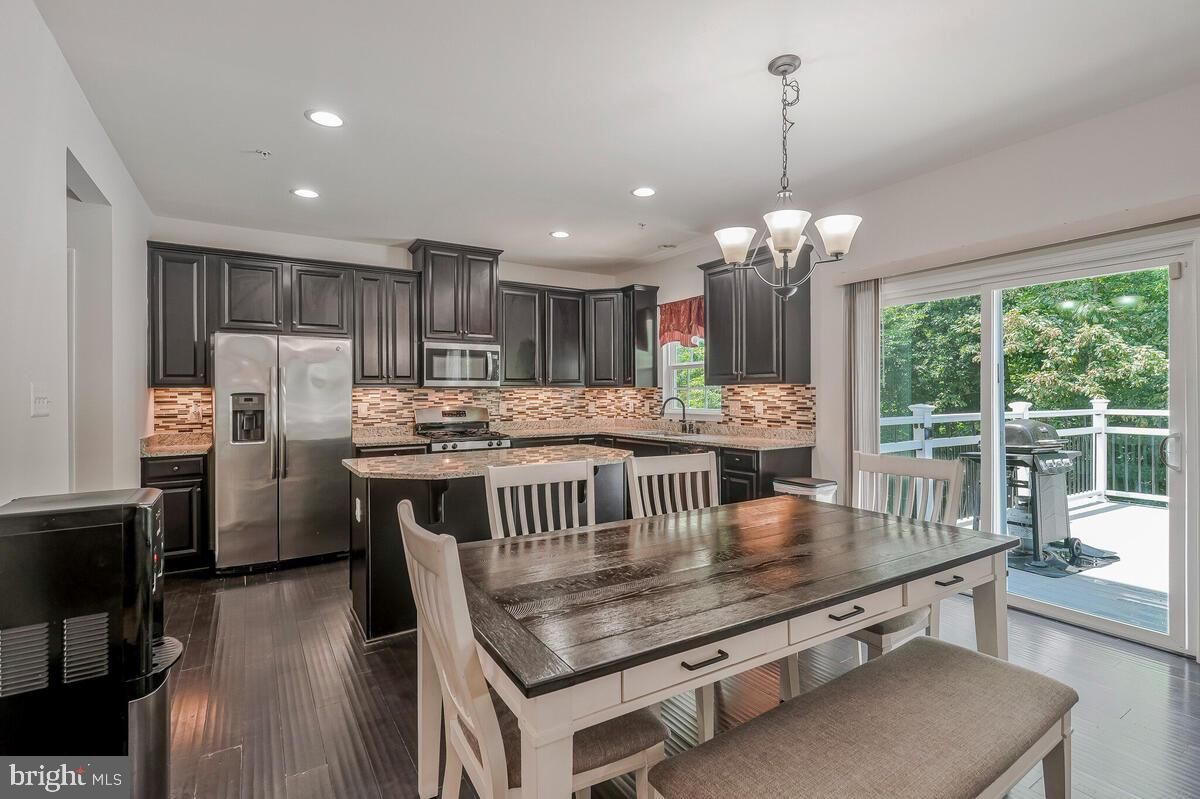 Chandelier, Dining room, Interior, Kitchen, Recessed Lighting, Stainless Steel Appliances, Wood Texture Flooring