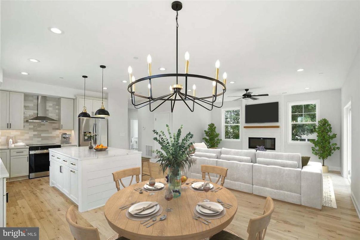 Chandelier, Dining room, Fireplace, Interior, Kitchen, Living room, Pendant Lights, Recessed Lighting, Stainless Steel Appliances, Wood Texture Flooring