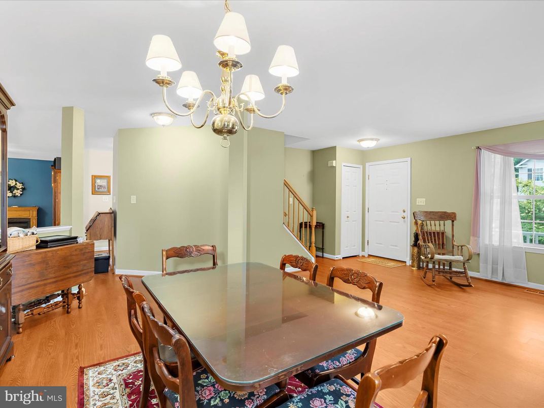 Chandelier, Dining room, Interior, Piano, Wood Texture Flooring
