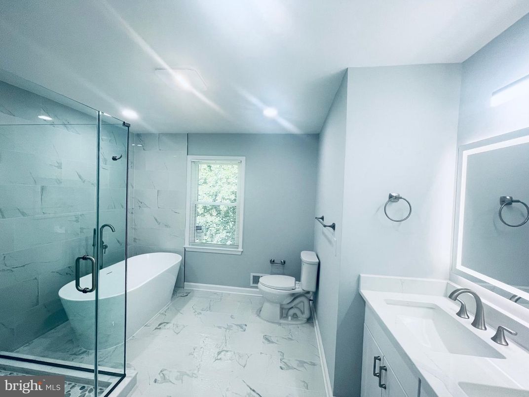 Bathroom, Dual Sink Vanities, Free Standing Baths, Glass Shower, Interior, Marble, Marble Walls, Recessed Lighting
