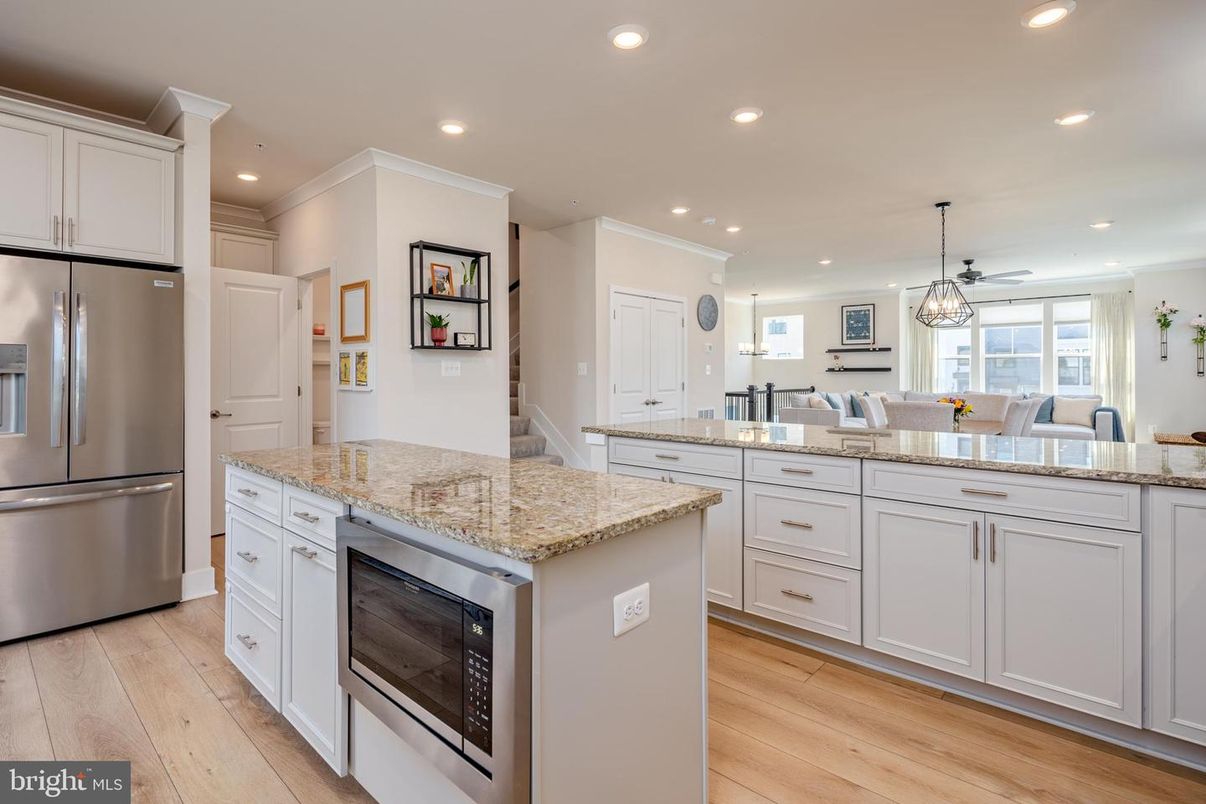 Dining room, Interior, Kitchen, Pendant Lights, Recessed Lighting, Stainless Steel Appliances, Wood Texture Flooring