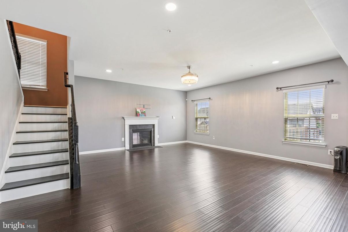 Chandelier, Empty room, Fireplace, Interior, Recessed Lighting, Wood Texture Flooring