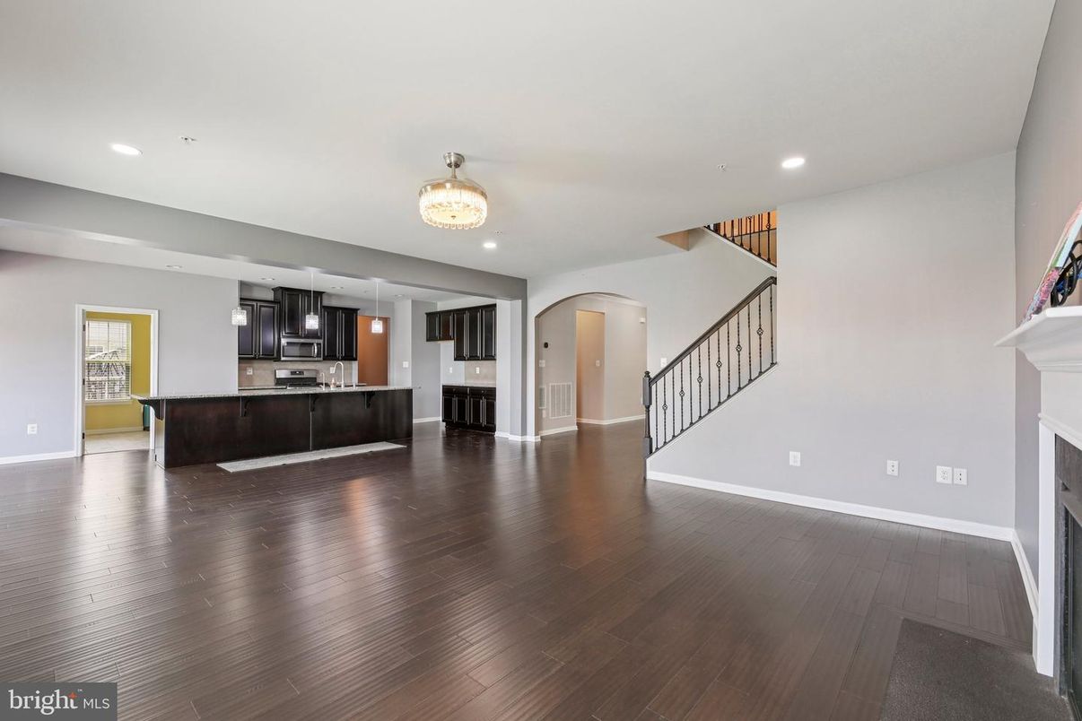 Fireplace, Interior, Kitchen, Recessed Lighting, Stainless Steel Appliances, Wood Texture Flooring