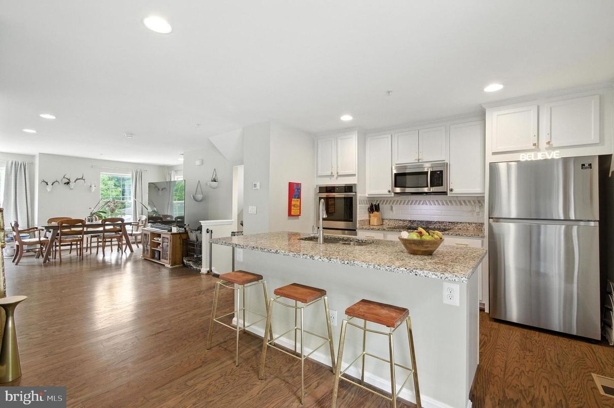 Dining room, Interior, Kitchen, Recessed Lighting, Stainless Steel Appliances, Wood Texture Flooring