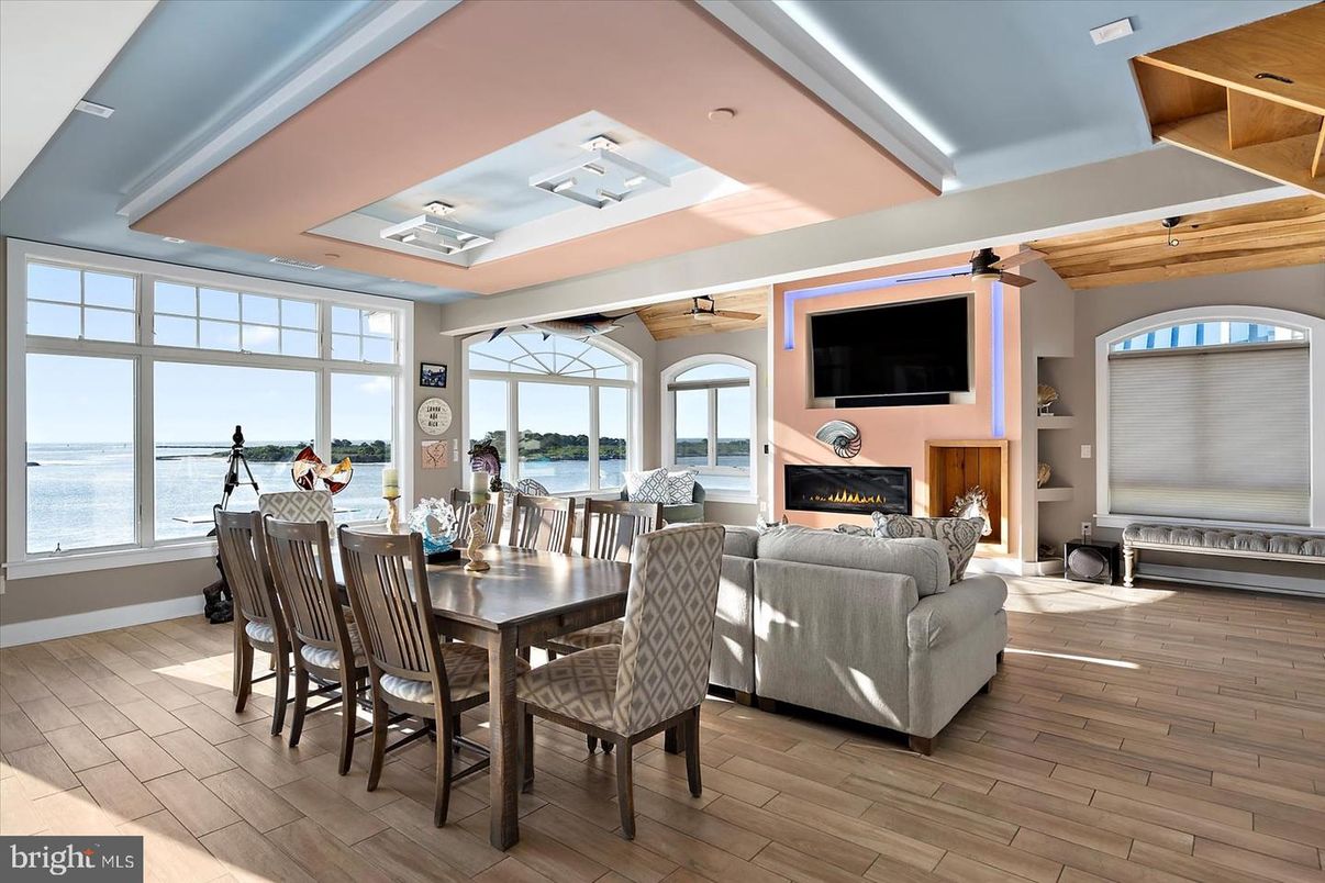 Dining room, Fireplace, Interior, Living room, Recessed Lighting, Water, Wood Texture Flooring