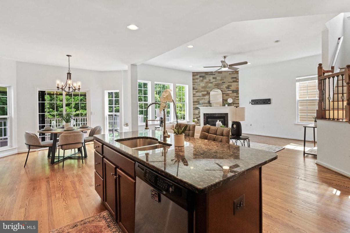 Chandelier, Dining room, Fireplace, Interior, Kitchen, Recessed Lighting, Wood Texture Flooring