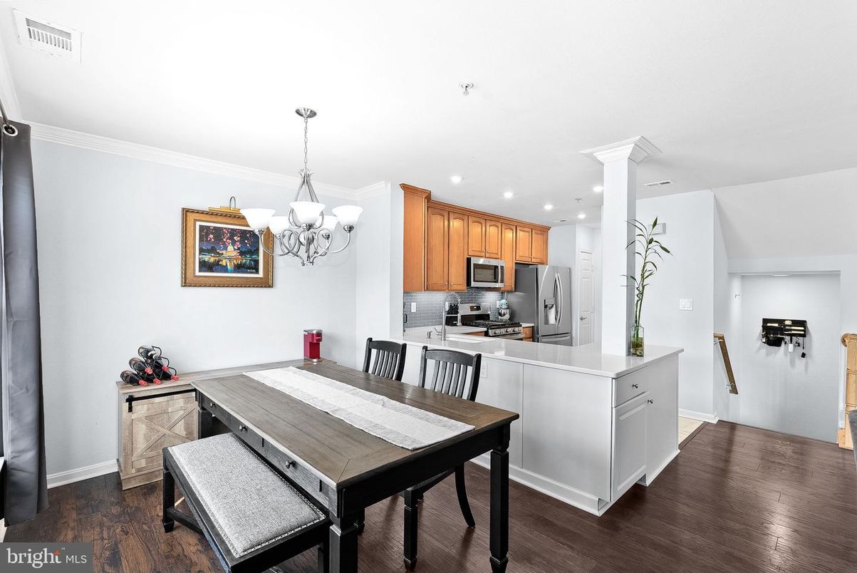 Chandelier, Dining room, Interior, Kitchen, Recessed Lighting, Stainless Steel Appliances, Wood Texture Flooring
