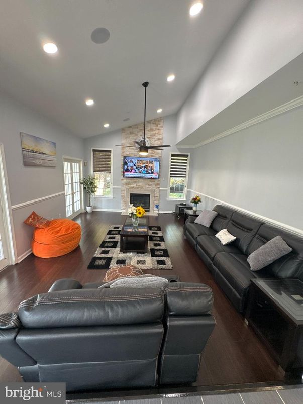 Fireplace, Interior, Living room, Pendant Lights, Recessed Lighting, Stone Walls, Wood Texture Flooring