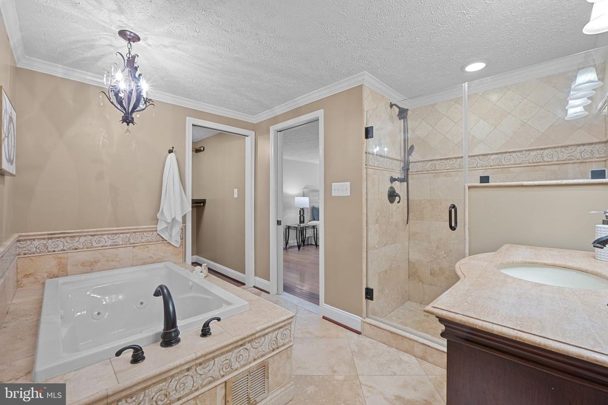Bathroom, Chandelier, Glass Shower, Interior, Recessed Lighting, Wood Texture Flooring