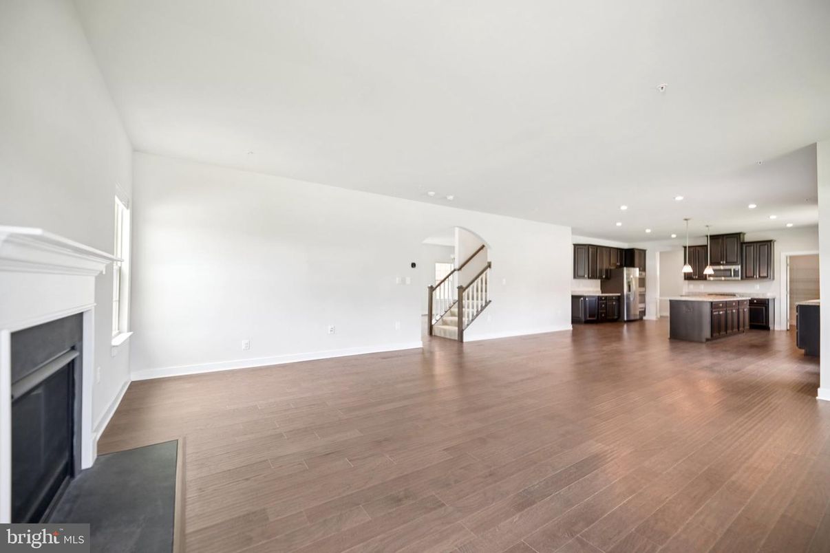 Empty room, Fireplace, Interior, Kitchen, Pendant Lights, Recessed Lighting, Wood Texture Flooring