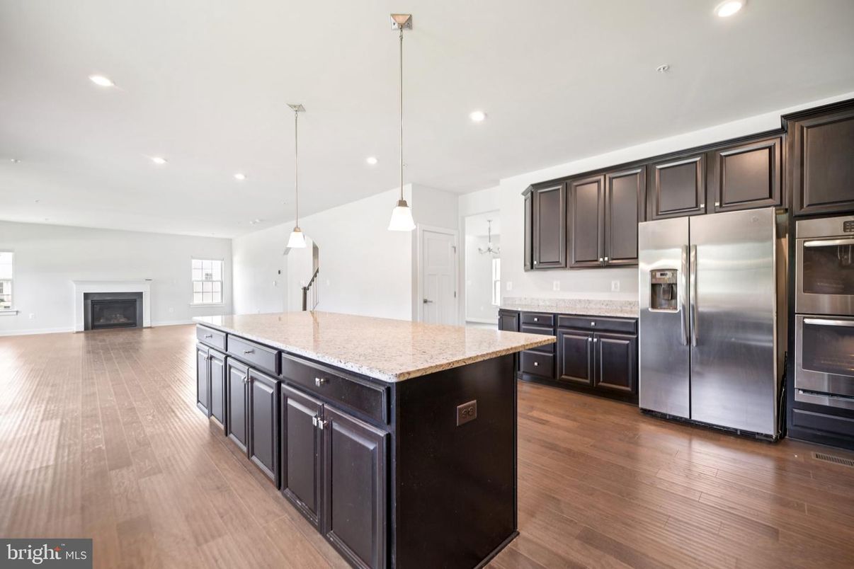 Fireplace, Interior, Kitchen, Pendant Lights, Recessed Lighting, Stainless Steel Appliances, Wood Texture Flooring