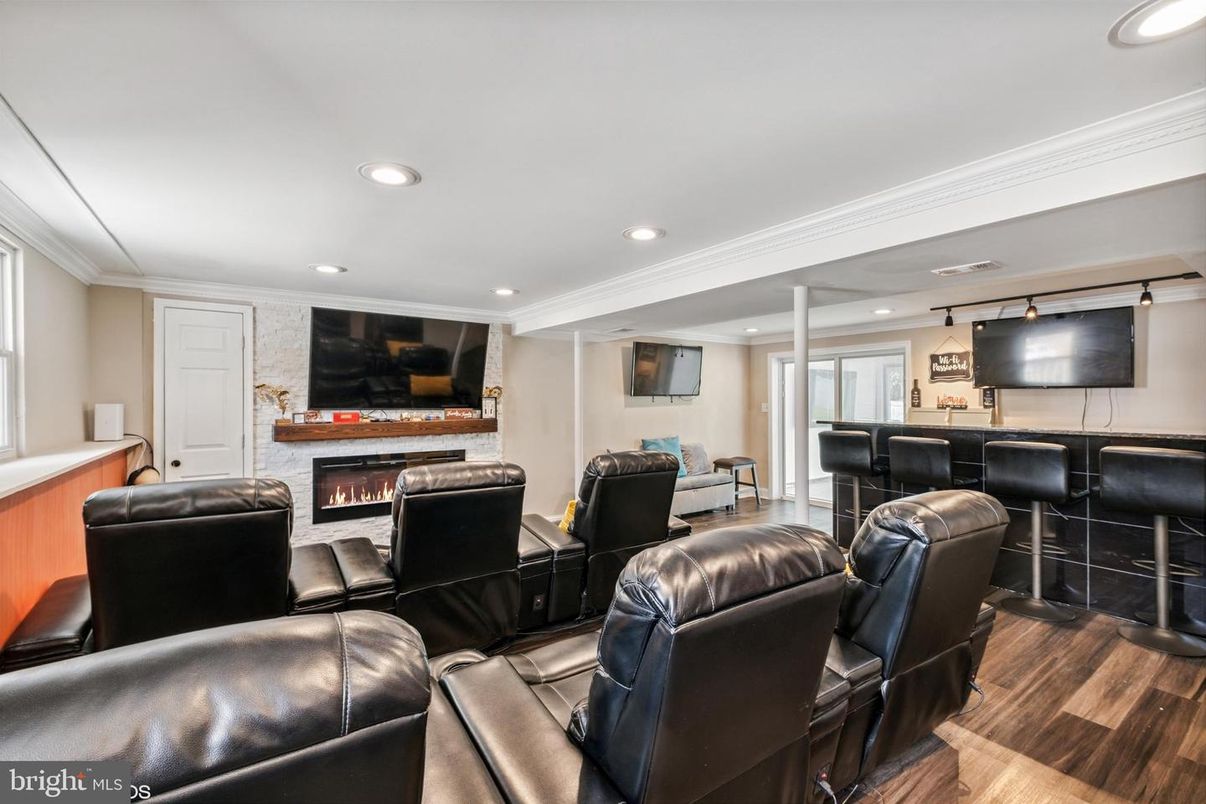 Home Theatre Room, Fireplace, Interior, Living room, Recessed Lighting, Theatre Room, Wood Texture Flooring