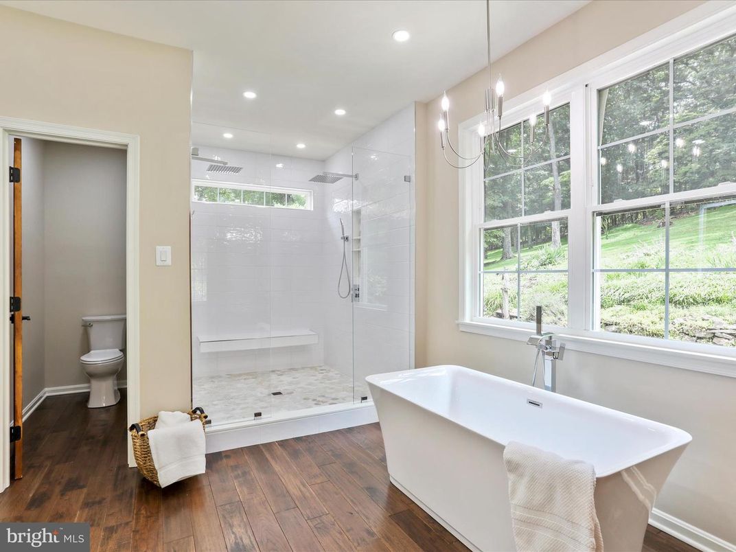 Bathroom, Free Standing Baths, Glass Shower, Interior, Pendant Lights, Recessed Lighting, Wood Texture Flooring