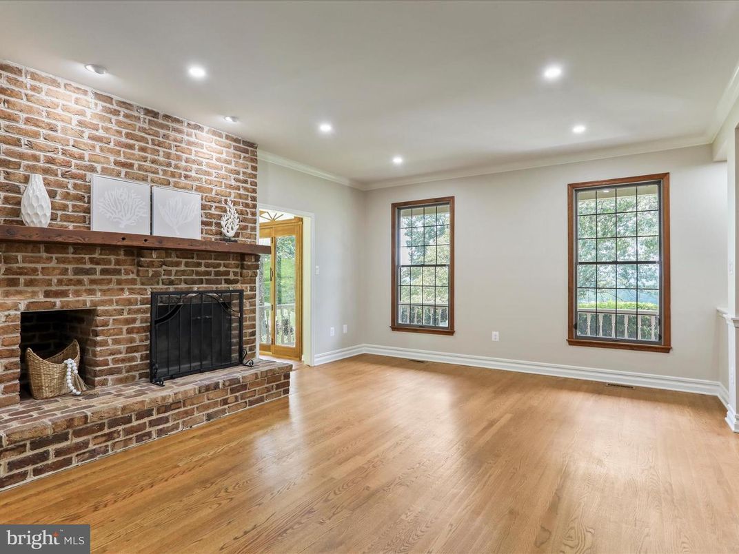 Empty room, Fireplace, Interior, Recessed Lighting, Stone Walls, Wood Texture Flooring