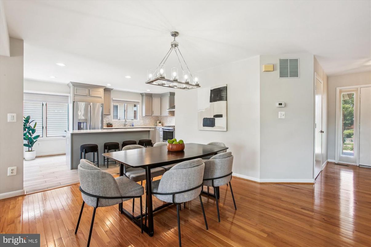 Chandelier, Dining room, Interior, Kitchen, Pendant Lights, Recessed Lighting, Stainless Steel Appliances, Wood Texture Flooring