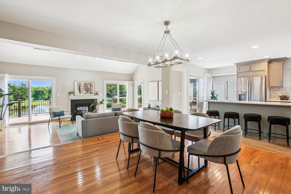 Dining room, Fireplace, Interior, Kitchen, Living room, Pendant Lights, Recessed Lighting, Stainless Steel Appliances, Wood Texture Flooring