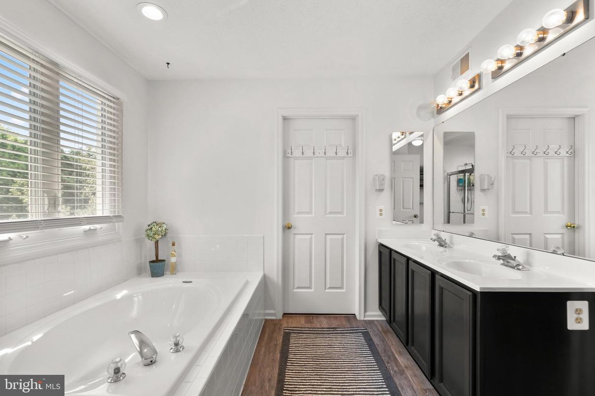 Bathroom, Dual Sink Vanities, Interior, Recessed Lighting, Wood Texture Flooring
