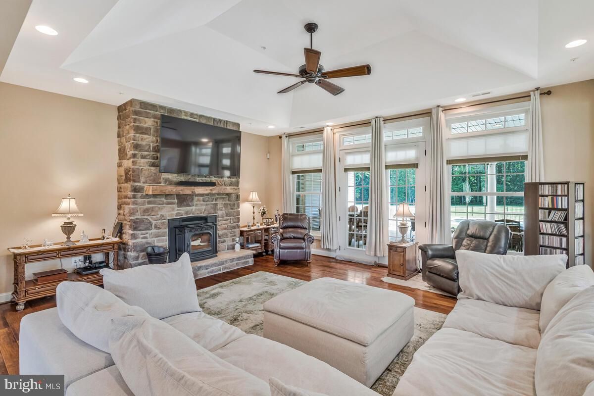 Fireplace, Interior, Living room, Recessed Lighting, Stone Walls, Wood Texture Flooring