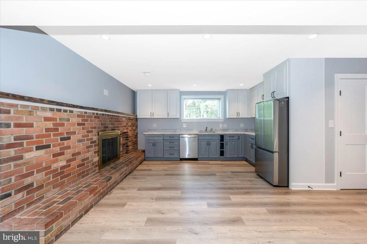 Fireplace, Interior, Kitchen, Recessed Lighting, Stone Walls, Wood Texture Flooring