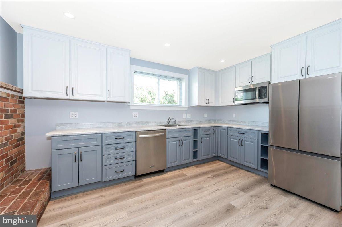 Interior, Kitchen, Recessed Lighting, Stainless Steel Appliances, Stone Walls, Wood Texture Flooring