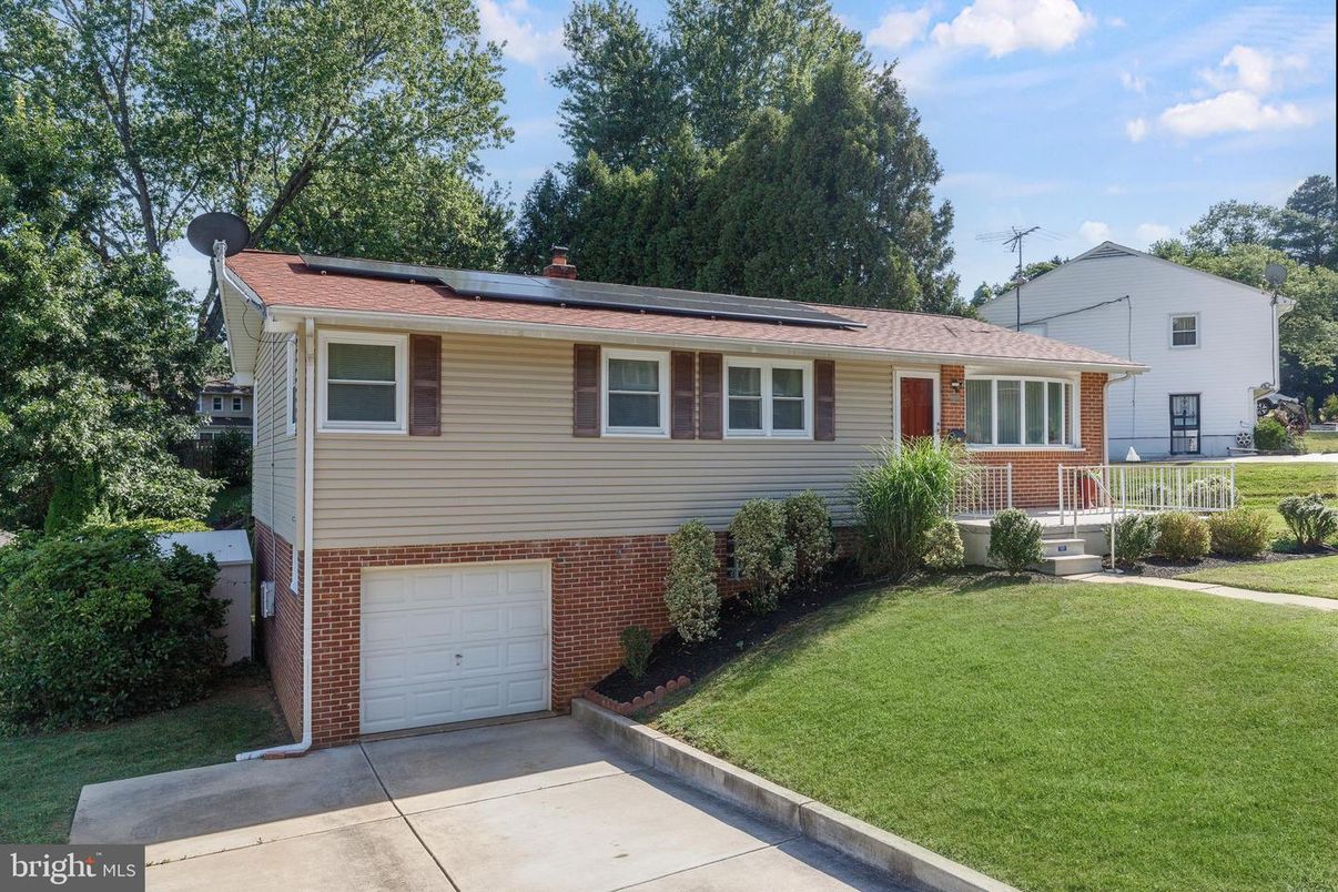 Attached, Exterior, Facade, Brick Facade, Solar Panels, Raised Ranch