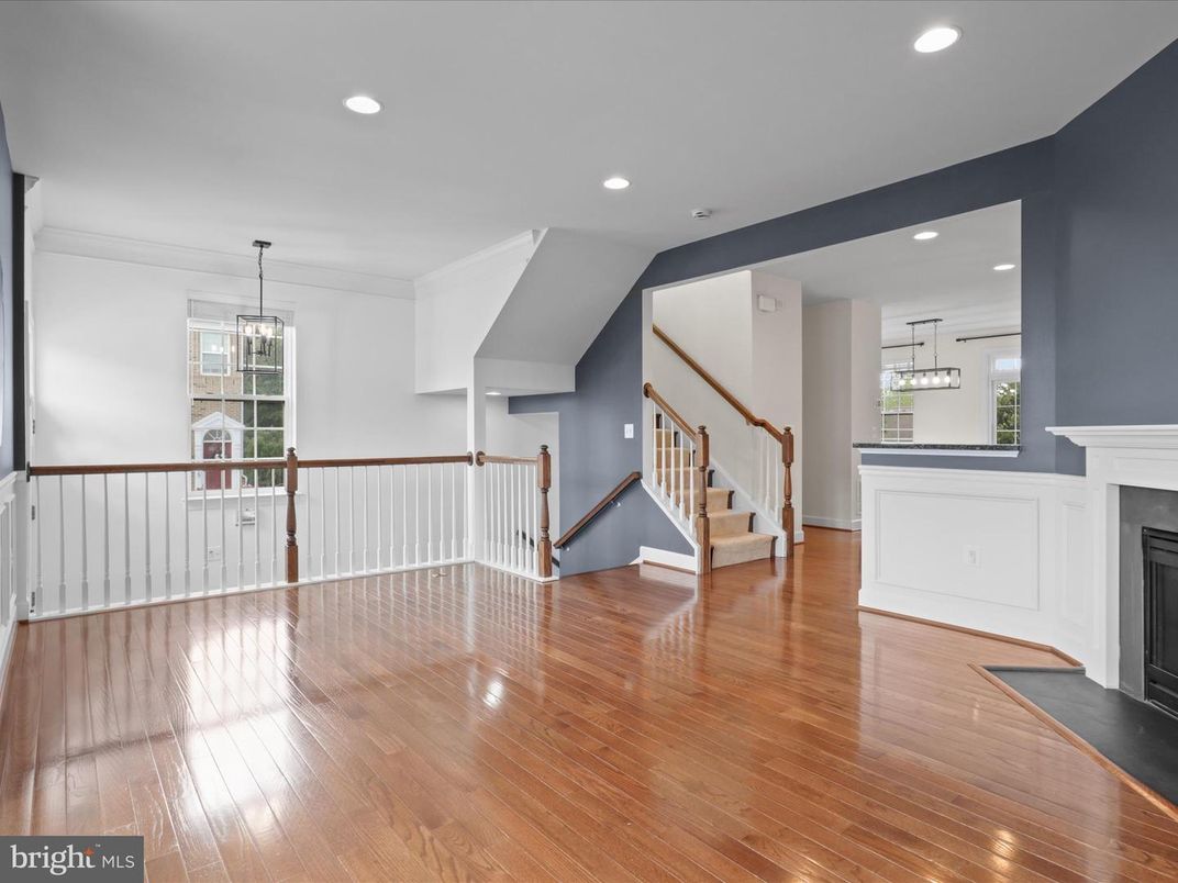 Empty room, Fireplace, Interior, Pendant Lights, Recessed Lighting, Wood Texture Flooring