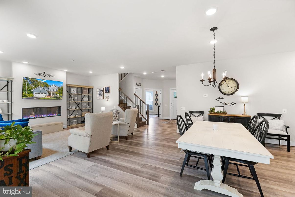Chandelier, Dining room, Fireplace, Interior, Living room, Pendant Lights, Recessed Lighting, Wood Texture Flooring