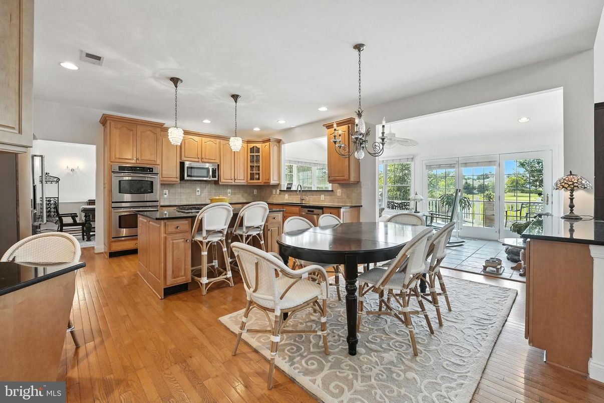 Chandelier, Dining room, Interior, Kitchen, Pendant Lights, Recessed Lighting, Stainless Steel Appliances, Wood Texture Flooring