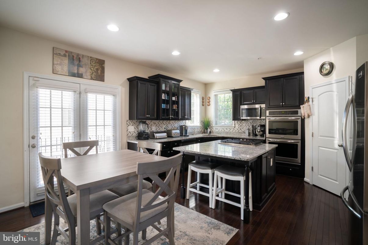 Dining room, Interior, Kitchen, Recessed Lighting, Stainless Steel Appliances, Wood Texture Flooring
